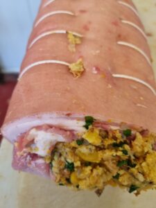 Rolled seasoned pork loin with apricot and macadamin