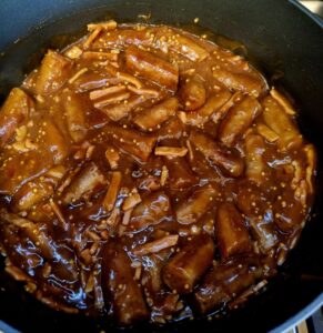 Sausages in Bacon Gravy in pan