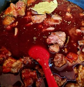 Beef in red wine in pan