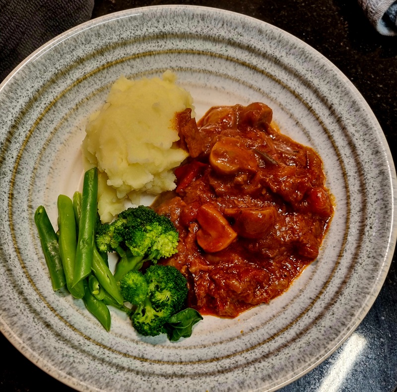 Beef in red wine on plate