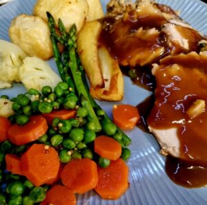 Pork apricot and macadamia on plate with vegetables